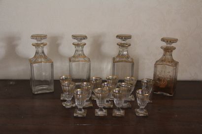 null Transparent glass and gilded edging liquor set including four decanters and...