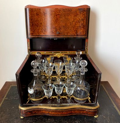 null A burl veneer, ebony and brass marquetry liquor cabinet, Napoleon III period

H...