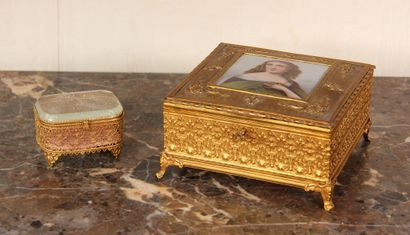 null Four-legged brass jewellery box decorated on the lid with a portrait of a woman...