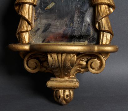 null A pair of gilded wood wall brackets decorated with drapery on a mottled glass...
