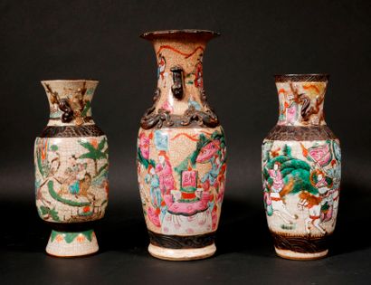 null Three cracked earthenware baluster vases with polychrome decoration of characters,...