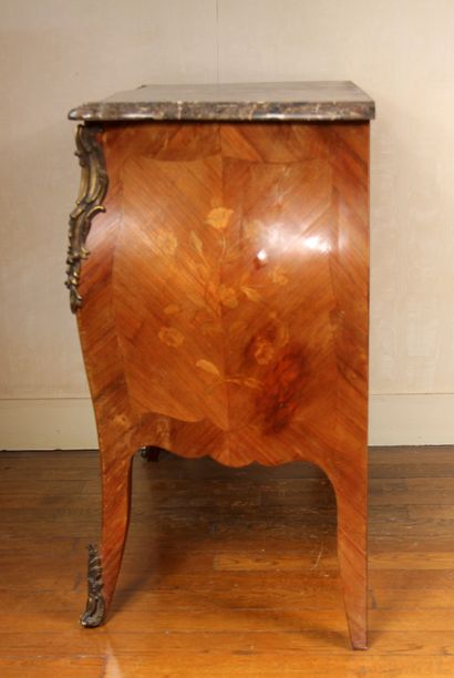 null A Louis XV style curved chest of drawers in veneer with flower inlays, two drawers...