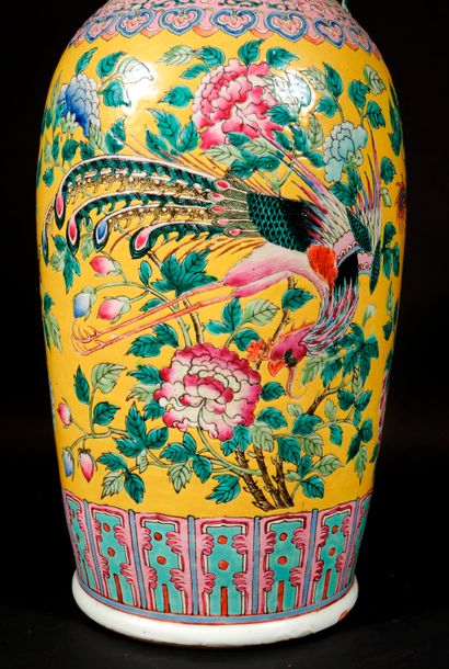 null Polychrome porcelain baluster with birds in branches on a yellow background,...