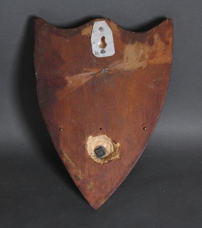 null A pair of sconces in the shape of a shield in burl veneer decorated with a round...