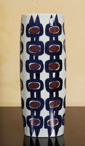null ROYAL COPENHAGEN

A tubular porcelain vase decorated with blue vertical friezes...