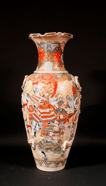 null A polychrome and gilded earthenware baluster vase decorated with characters...