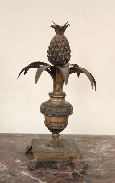 null A bronze and brass quadripod toothpick stand in the form of a vase on a pedestal...