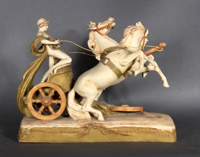 null ROYAL DUX 

The chariot.

Painted biscuit group, marked.

H : 34,5 cm

W : 45...