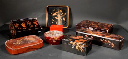 null A set of black, brown and red lacquer boxes and trays with gilded decoration,...