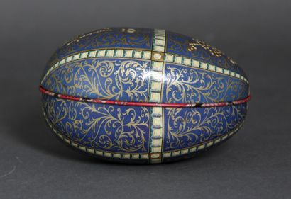 null Oval metal box with polychrome printed decoration imitating a Fabergé egg

L...