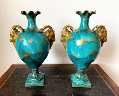 null A pair of blue and gold glazed porcelain baluster vases on pedestal with goat...