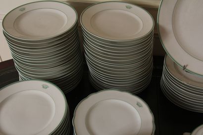 null Part of a round porcelain dinner service, white with green edging decorated...