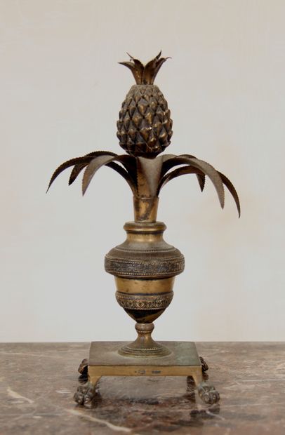 null A bronze and brass quadripod toothpick stand in the form of a vase on a pedestal...