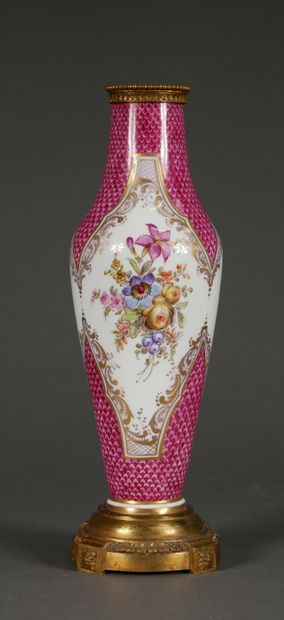 null A polychrome porcelain baluster lamp base with flowers in medallions on a pink...