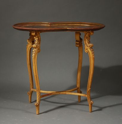 null A pedestal table with a wooden top painted with children playing, with a four-legged...