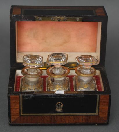 null Perfume box in veneer and brass containing three gilded glass falcons, 19th...