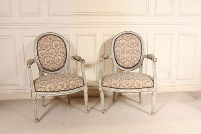 null Two cabriolet armchairs with medallion backs, one with fluted tapered legs and...