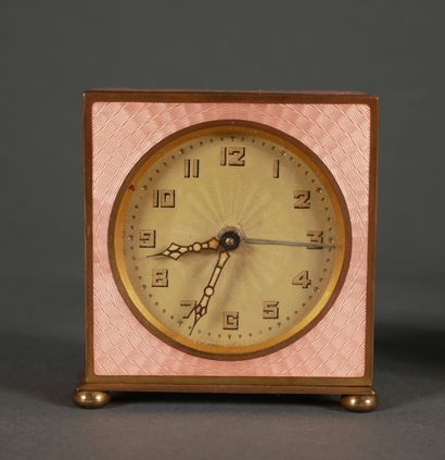 null Lot of three clocks:

- ELLIOTT SON

Oval brass officer's clock with landscape...