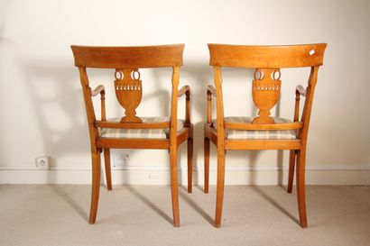 null Pair of chairs and armchairs in natural wood with openwork back decorated with...