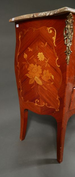null A Louis XV style veneered chest of drawers with three drawers on three rows,...