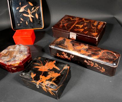 null A set of black, brown and red lacquer boxes and trays with gilded decoration,...