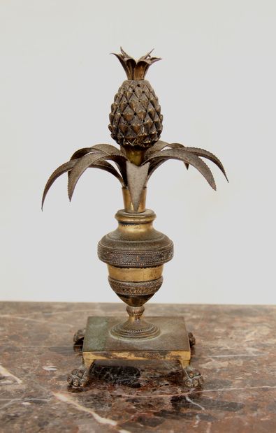  A bronze and brass quadripod toothpick stand in the form of a vase on a pedestal...