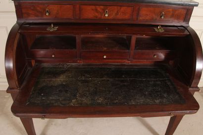 null Mahogany veneered stepped cylinder desk, sheath legs, black marble top, 19th...