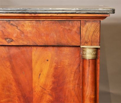 null A burr veneer desk with half columns and a grey marble top, 19th century.

H...