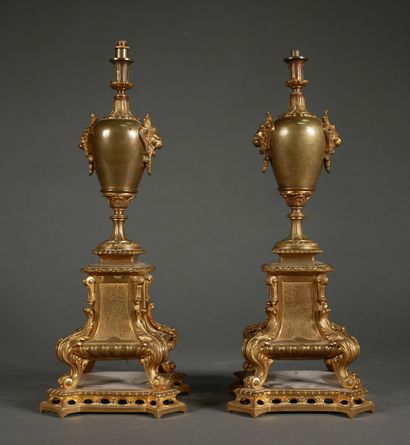 null A pair of bronze quadripod bases resting on an openwork plinth, mounted as a...