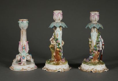 null Lot :

- Pair of polychrome porcelain candlesticks decorated with a couple of...