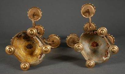 null A pair of bronze and porcelain candelabras decorated with putti and bouquets...