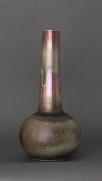 null Lot:

- A long-necked globular terra-cotta vase on a heel, with green and pink...