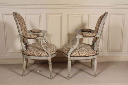 null Two cabriolet armchairs with medallion backs, one with fluted tapered legs and...