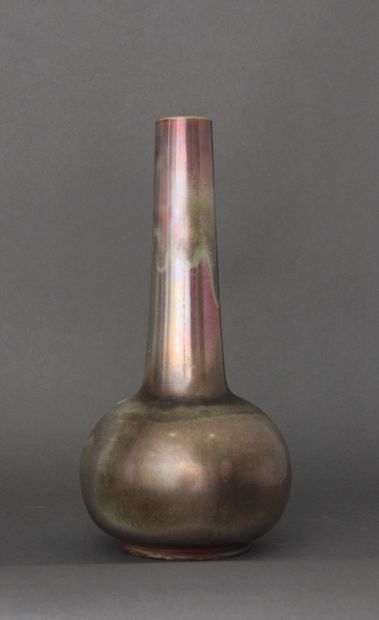 null Lot:

- A long-necked globular terra-cotta vase on a heel, with green and pink...