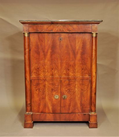 null A burr veneer desk with half columns and a grey marble top, 19th century.

H...