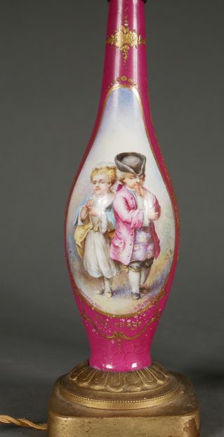 null Pair of polychrome porcelain baluster vases with children's couples in medallions...