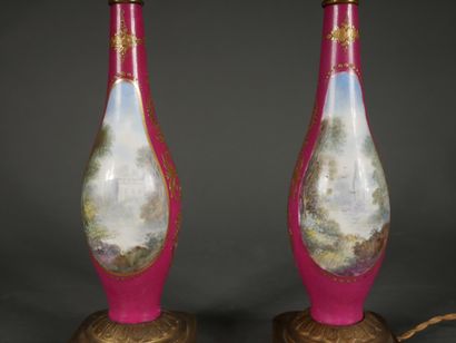 null Pair of polychrome porcelain baluster vases with children's couples in medallions...
