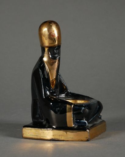 null *CLEMENT

Earthenware candlestick in the shape of a seated man with black and...