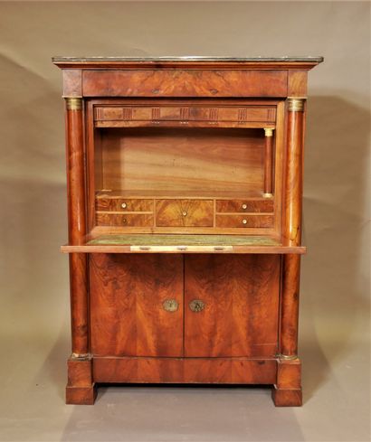 null A burr veneer desk with half columns and a grey marble top, 19th century.

H...