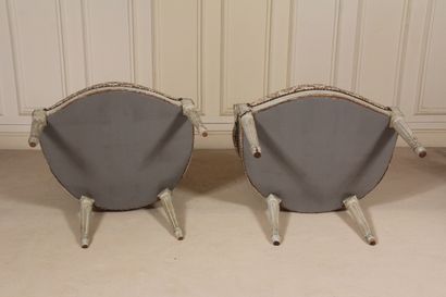 null Two cabriolet armchairs with medallion backs, one with fluted tapered legs and...