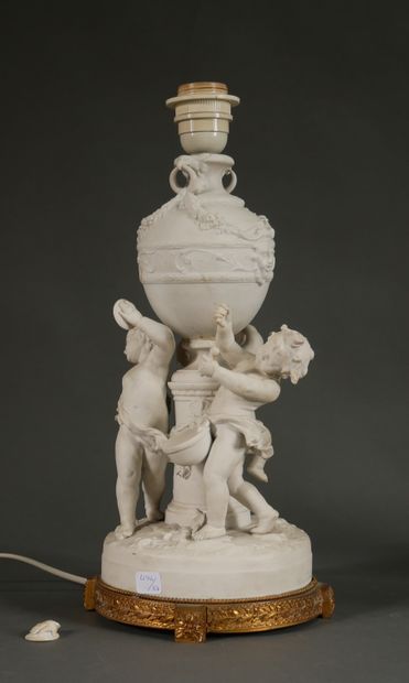 null KARL ENS FACTORY

Bisque group representing putti musicians around an antique...
