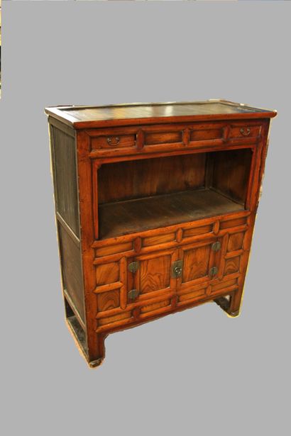 null A zelkova and pine wood cabinet, with a light patina, two levels on four feet,...