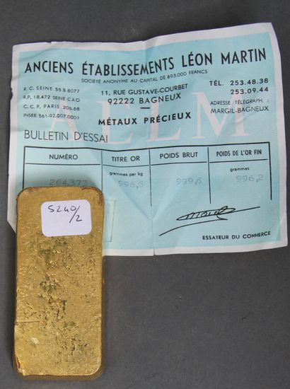 null *Lingot en or Ancien établissement Léon Martin n°264373, pds : 996,6 g., avec...