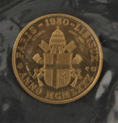 null *LA MONNAIE DE PARIS

Une pièce commémorative Jean Paul II 1980 en or 999,9°/°°,...