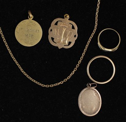 null 18k yellow gold lot:

- Two religious pendants, wt: 2.1-3.3 g.

- An engraved...