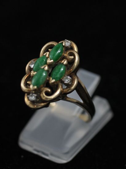null 
*Marquise ring in 9k yellow gold set with cabochons of green and white stones,...