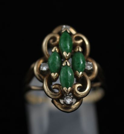 null 
*Marquise ring in 9k yellow gold set with cabochons of green and white stones,...