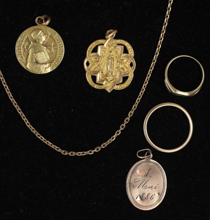 null 18k yellow gold lot:

- Two religious pendants, wt: 2.1-3.3 g.

- An engraved...
