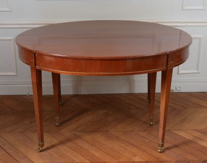 null Mahogany veneered oval dining room table resting on six fluted legs.

	19th...