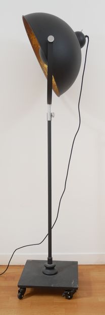 null Studio lamp made up of a black lacquered metal projector, tubular shaft on a...